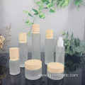 High-grade Cosmetic transparent Frosted glass bottles/jars with wood grain cap